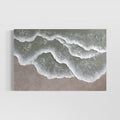 Beach artwork with sage and white textured waves rolling in on a sandy beige shore